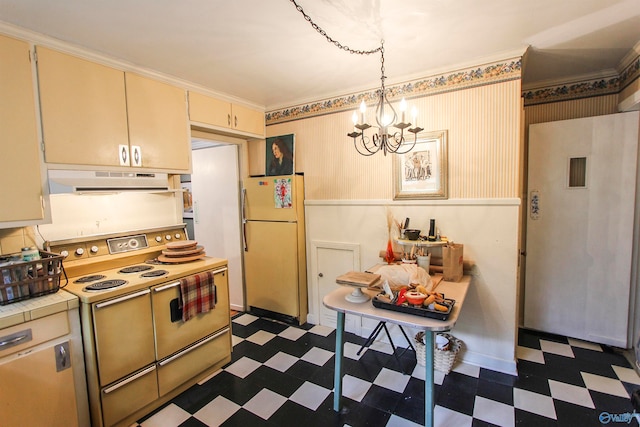 kitchen featuring dark tile patterned flooring, white appliances, pendant lighting, and an inviting chandelier