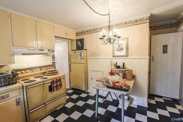 kitchen with under cabinet range hood, electric range oven, dark floors, and freestanding refrigerator