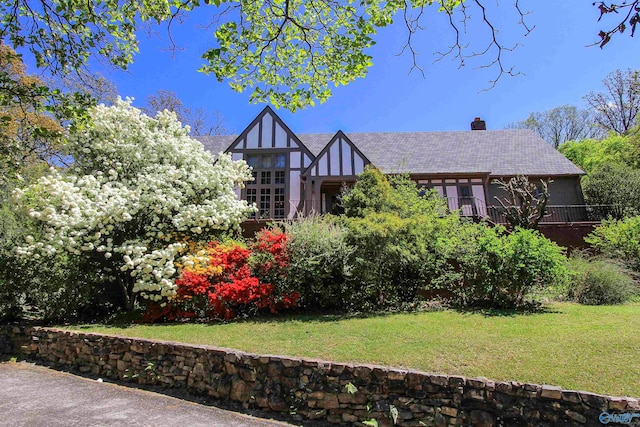 tudor house with a front yard