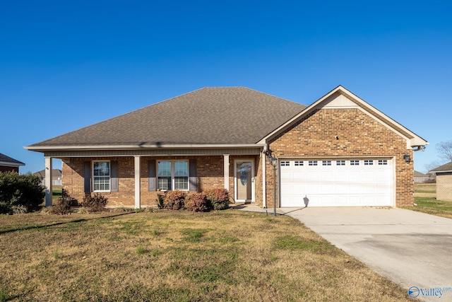 view of front of property with a front lawn and a garage