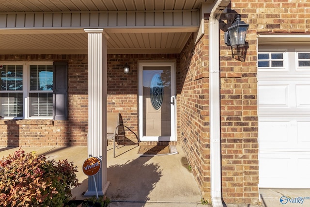 view of exterior entry featuring a garage