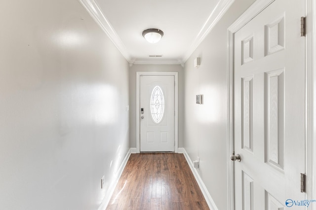 entryway featuring dark wood-type flooring and ornamental molding