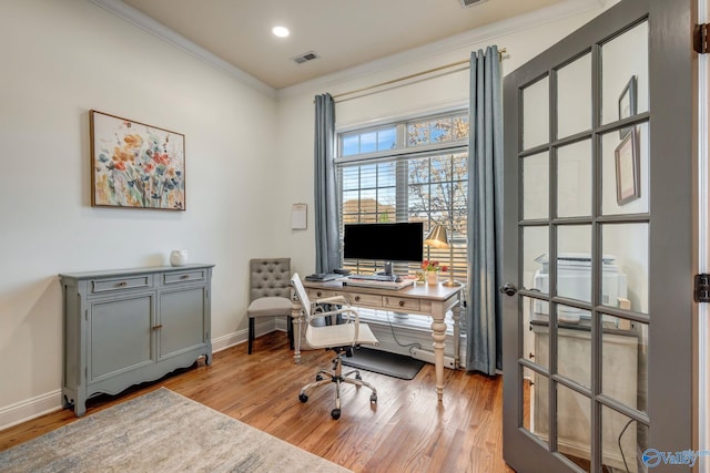 office space featuring visible vents, crown molding, baseboards, recessed lighting, and light wood-style floors