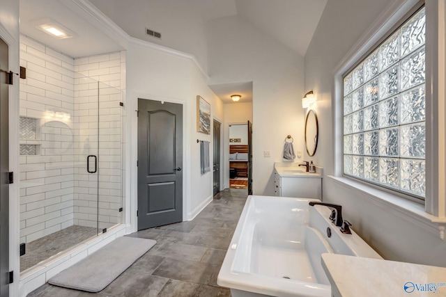 full bathroom featuring vanity, visible vents, baseboards, lofted ceiling, and a stall shower