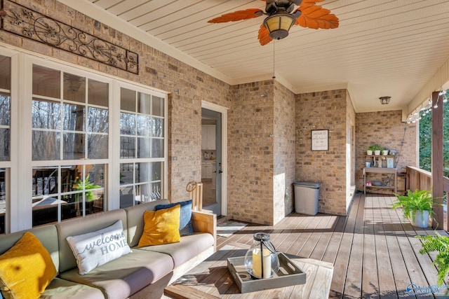 deck featuring ceiling fan and outdoor lounge area