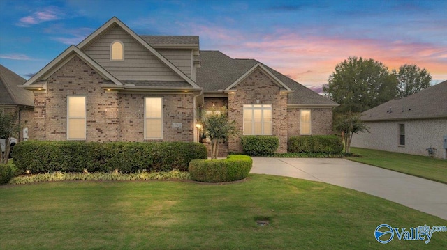 view of front of property with a lawn