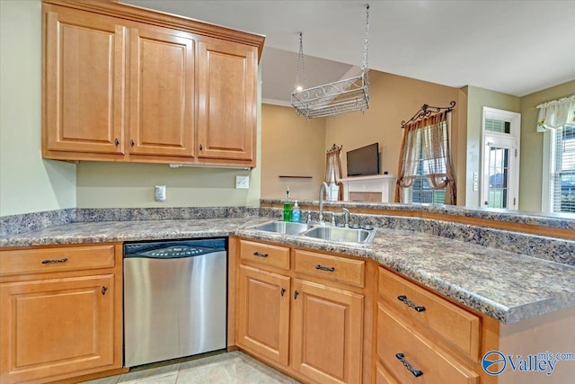 kitchen with dishwasher, kitchen peninsula, sink, and light tile patterned flooring