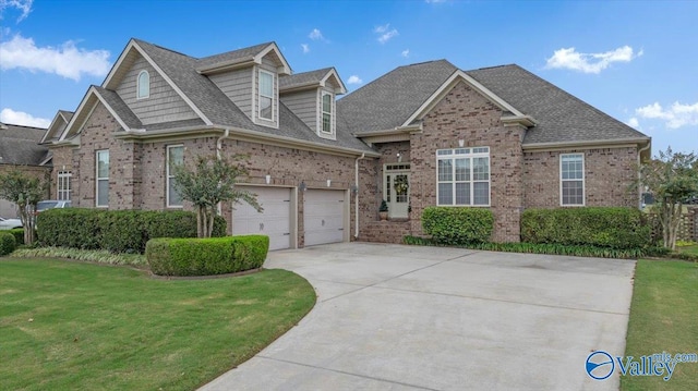 view of front of property featuring a garage and a front lawn