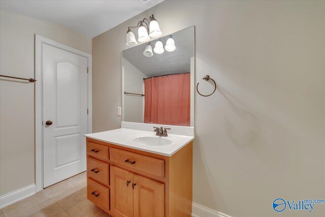 17902 Watercress Dr, Athens, AL 35611 - bathroom with vanity, baseboards, and tile patterned floors