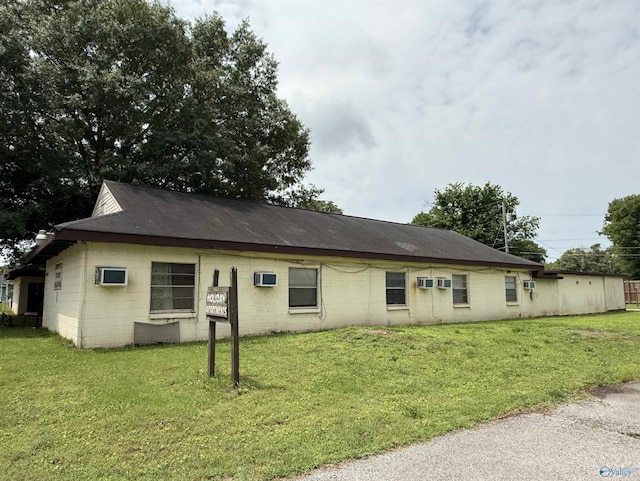 3004 SW Clopton St Unit 28, Huntsville, AL 35805 - view of front of home with concrete block siding and a front lawn