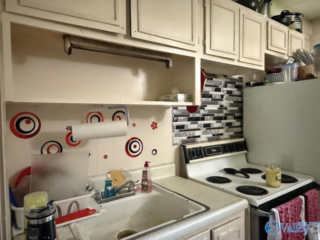 3004 SW Clopton St Unit 28, Huntsville, AL 35805 - kitchen with electric range, light countertops, a sink, and open shelves