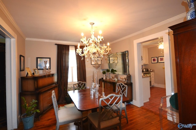 dining room with ornamental molding, hardwood / wood-style floors, and a notable chandelier