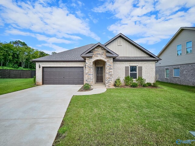 view of front of house with a garage and a front yard