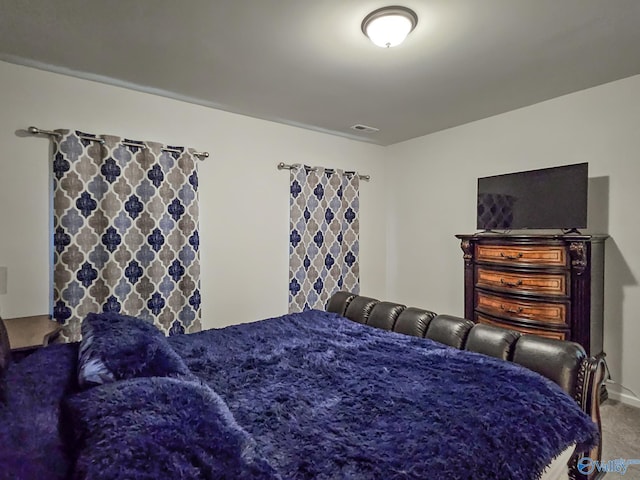 bedroom featuring visible vents and carpet flooring