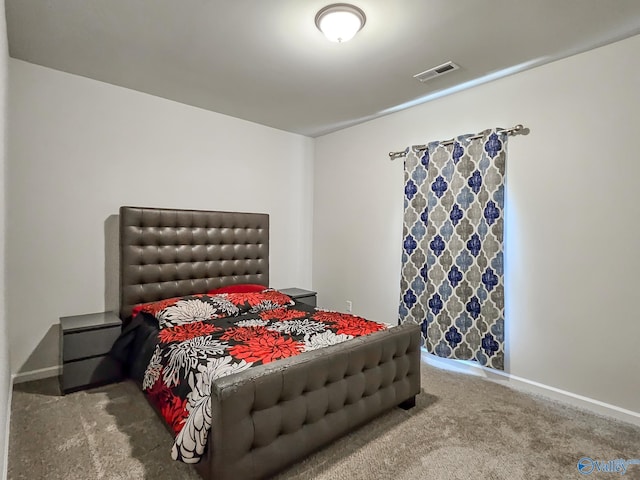 carpeted bedroom with baseboards and visible vents