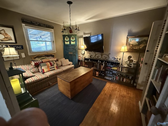 living area featuring crown molding and wood finished floors