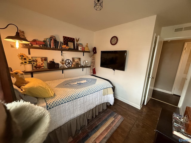 bedroom with visible vents and baseboards