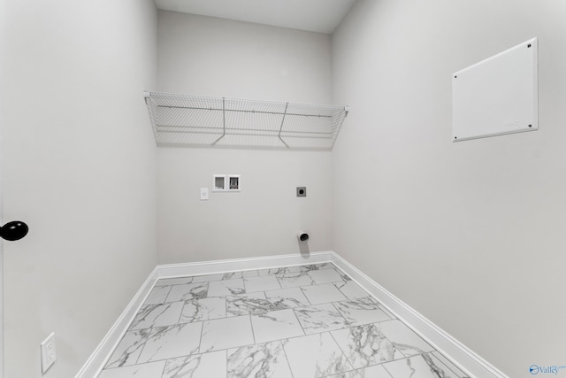 clothes washing area featuring laundry area, marble finish floor, electric dryer hookup, and baseboards