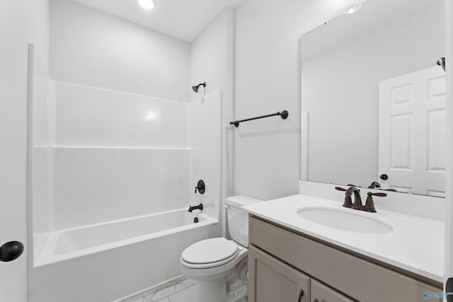 full bathroom featuring toilet, marble finish floor, vanity, and shower / tub combination