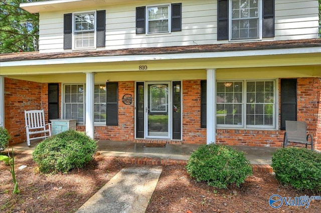 property entrance with covered porch