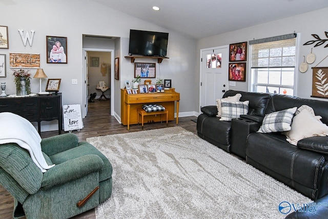 living room featuring dark wood-type flooring and lofted ceiling