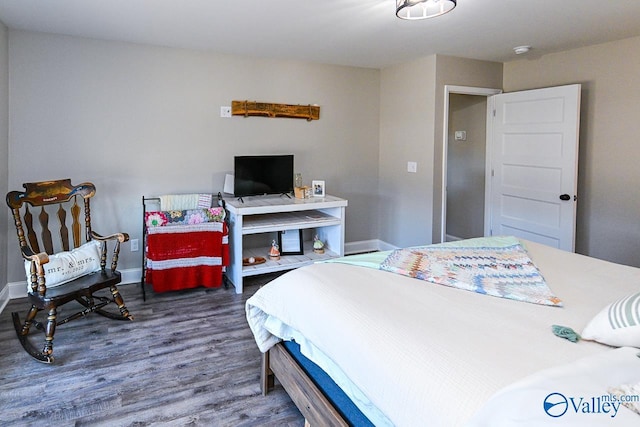 bedroom featuring dark hardwood / wood-style floors