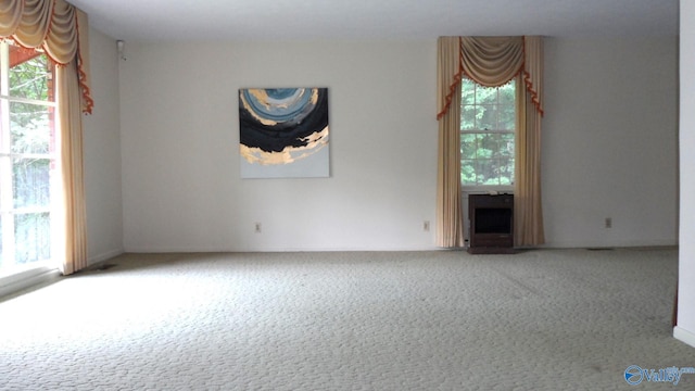 unfurnished room with carpet floors