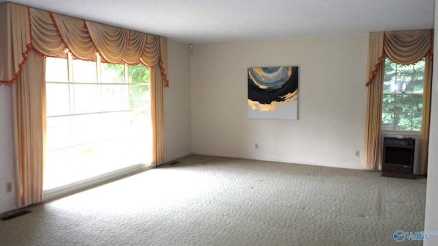 empty room featuring carpet flooring