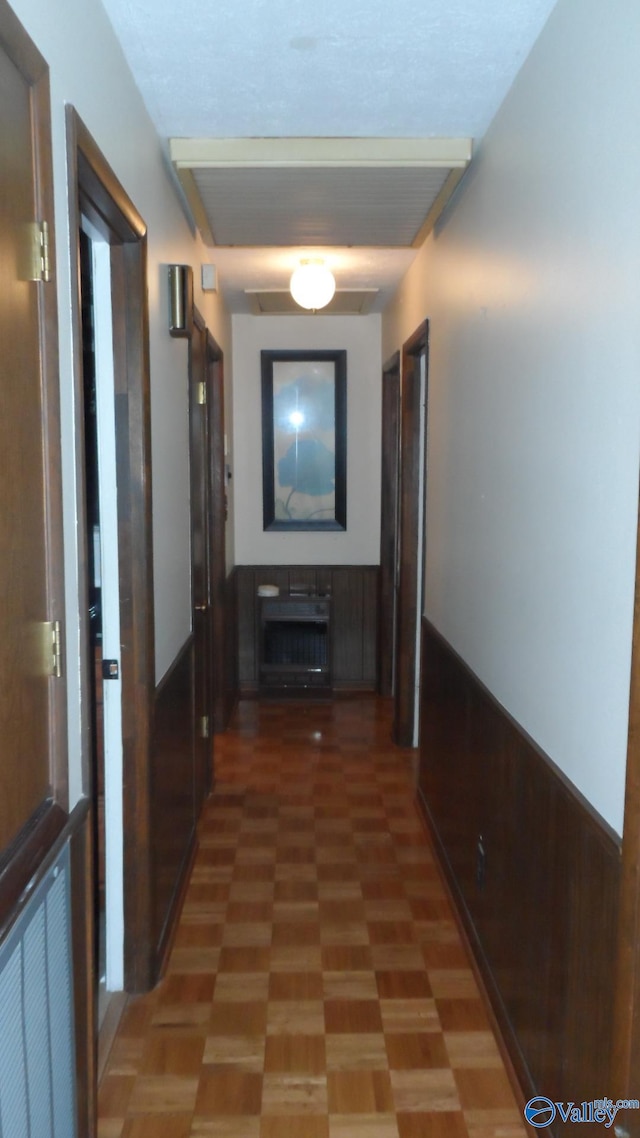 hallway featuring tile patterned flooring