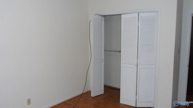 unfurnished bedroom featuring a closet