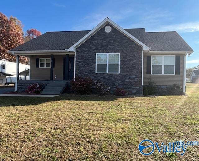 view of front of property with a front yard and a porch