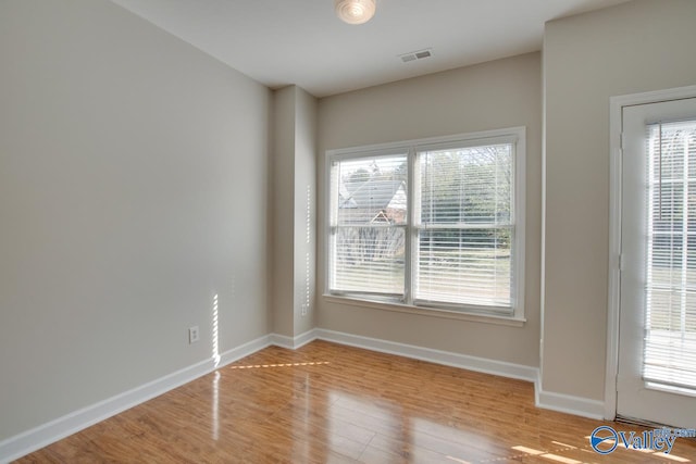 empty room with light wood-type flooring