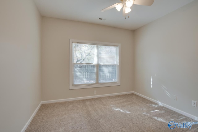 empty room featuring carpet flooring and ceiling fan