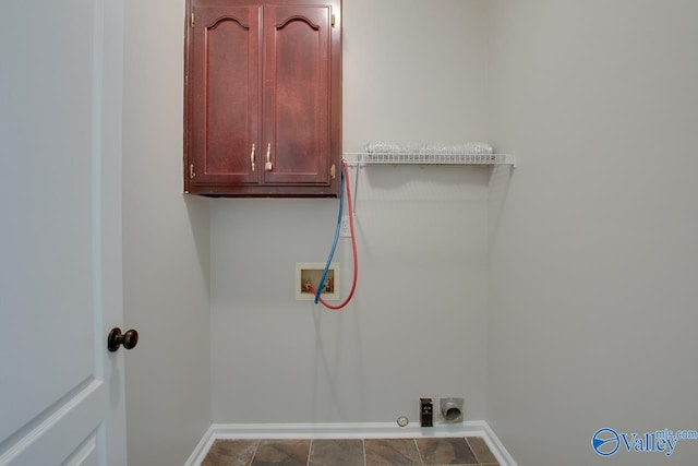 laundry room featuring washer hookup, cabinets, and hookup for an electric dryer