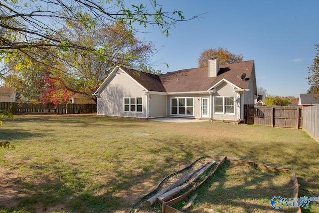107 Palomino Ct, Madison, AL 35758 - back of property with a chimney, a fenced backyard, and a patio area