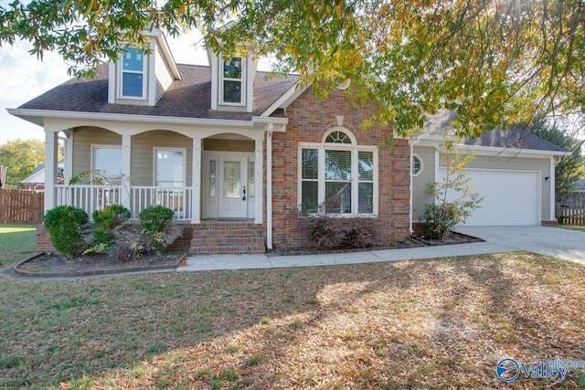 107 Palomino Ct, Madison, AL 35758 - view of front of home with covered porch, a garage, brick siding, driveway, and roof with shingles