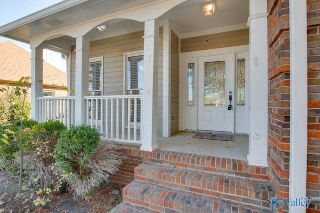 property entrance featuring covered porch