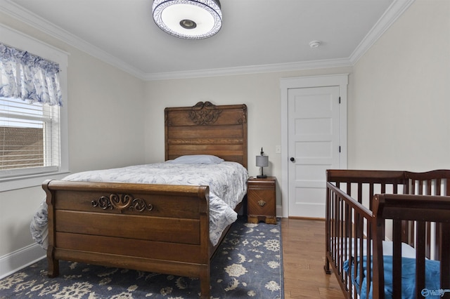 855 Haynes Rd NE, Arab, AL 35016 - bedroom with crown molding, wood finished floors, and baseboards