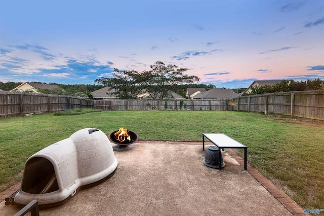 yard at dusk with a patio