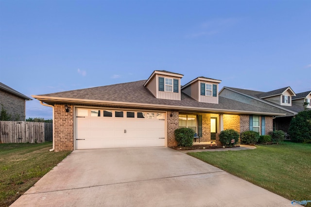 view of front facade featuring a front lawn, a porch, and a garage