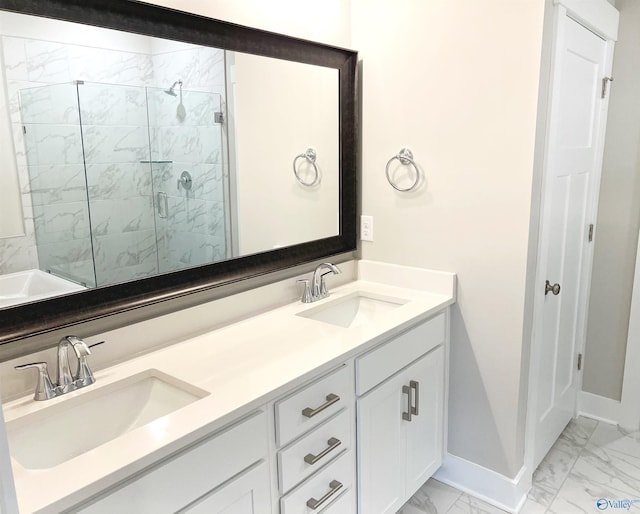 bathroom with a shower with door and vanity