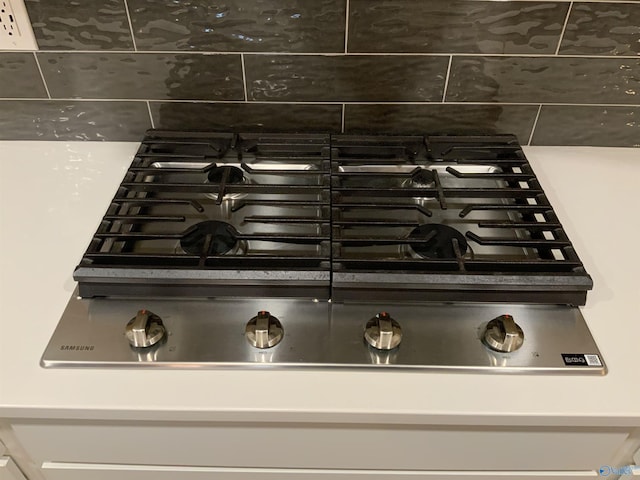 room details featuring white cabinetry and stainless steel gas cooktop