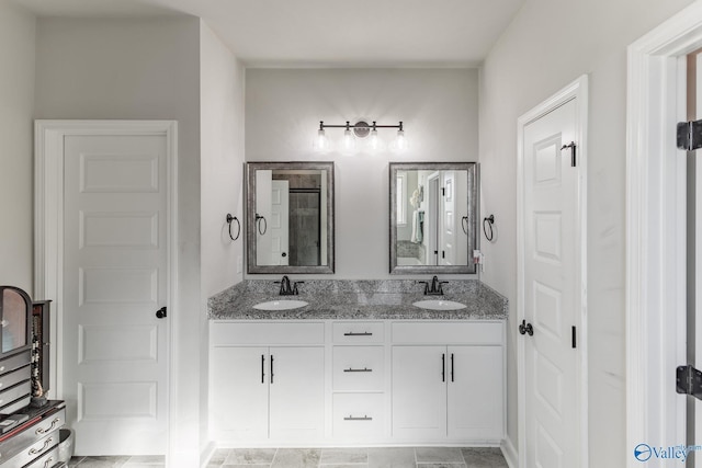 bathroom with double vanity and a sink