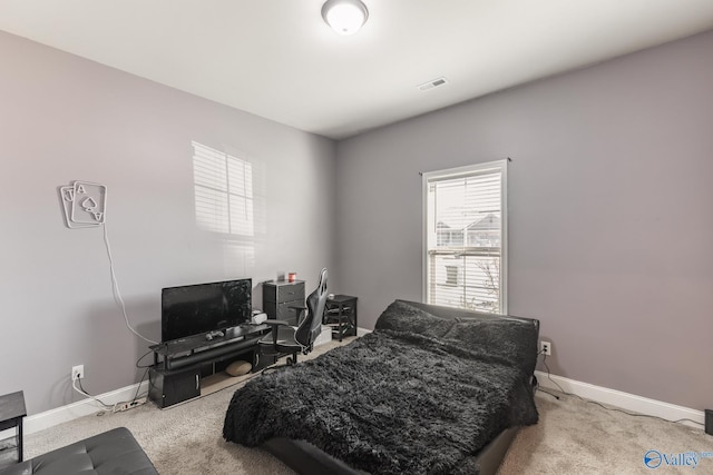 bedroom featuring carpet flooring, visible vents, and baseboards