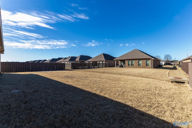 view of yard with fence and a residential view