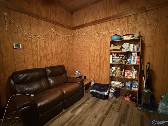 interior space with wood finished floors and wooden walls