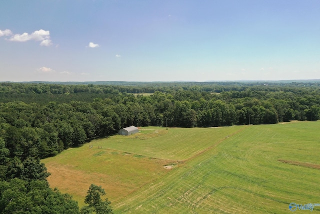 drone / aerial view featuring a forest view