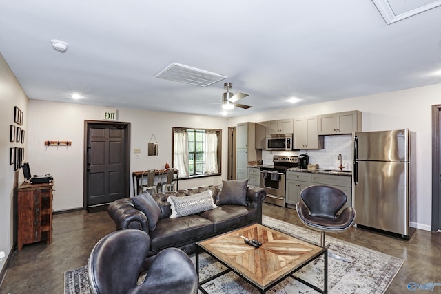 living room with sink and ceiling fan