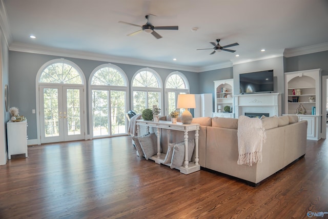 living room with french doors, ceiling fan, plenty of natural light, and dark wood-type flooring