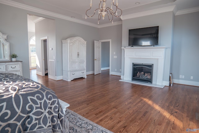 bedroom featuring crown molding, dark hardwood / wood-style floors, and a chandelier